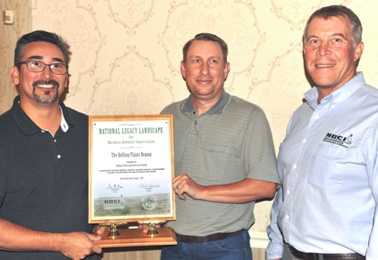 Accepting the Legacy Landscape designation for the Rolling Plains region were Robert Perez of the Texas Parks & Wildlife Commission and Kyle Johnson of the Oklahoma Department of Wildlife Conservation. NBCI Director Don McKenzie is at right.