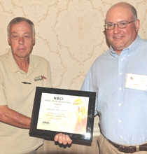 Bob Glennon, left, accepts NBCI National Fire Bird Conservation Award from Virginia quail coordinator Marc Puckett